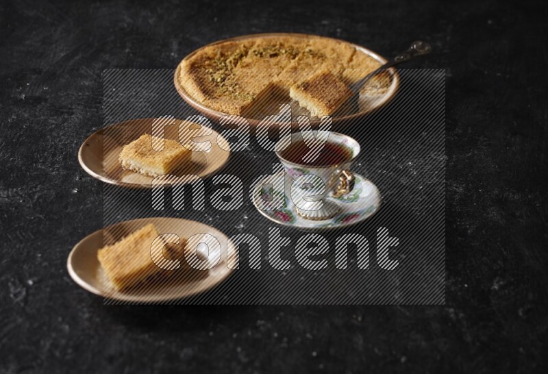 konafa with tea in a dark setup