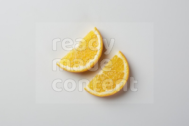 Two halves of an orange slices on white background