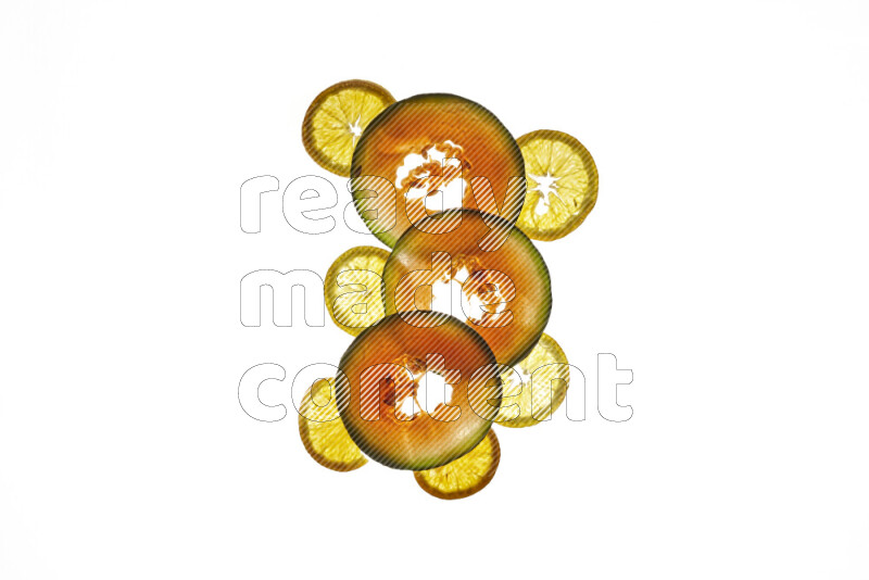 Mixed fruits slices on illuminated white background