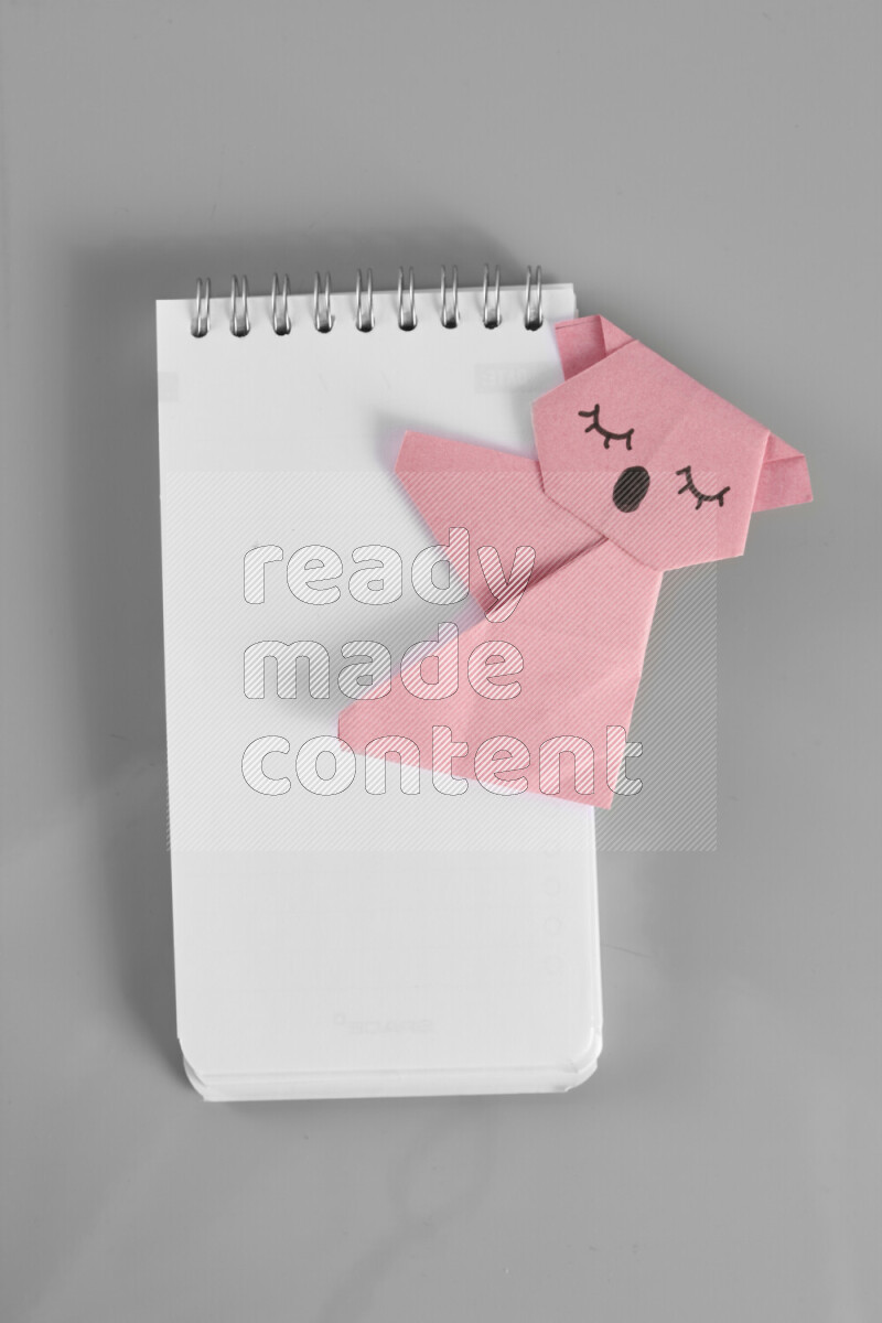 Origami animals on grey background