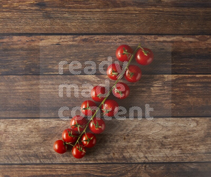 Single cherry tomato vein topview on a wooden background
