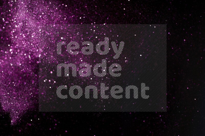 Pink glitter powder isolated on black background