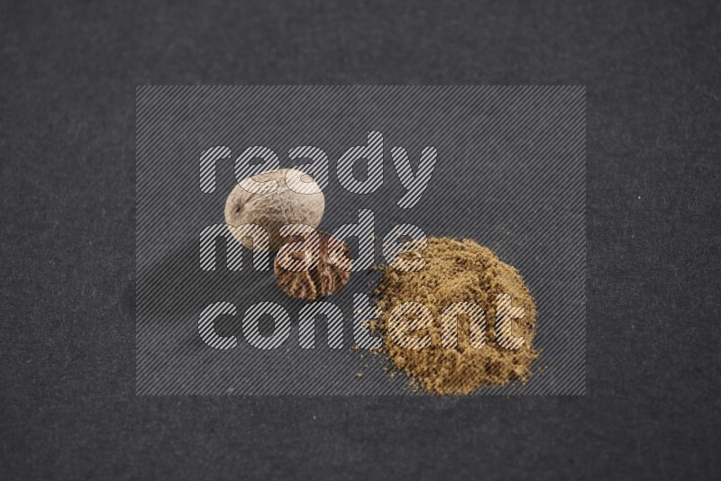 Nutmeg seeds with nutmeg powder beside it on a black flooring in different angles