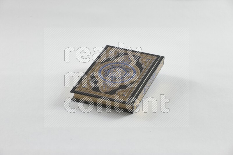 Quran with a prayer beads on white background