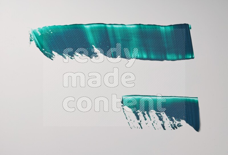 Turquoise painting knife strokes on white background