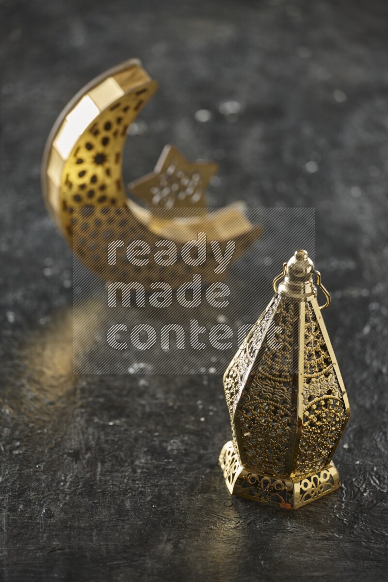 A crescent lantern with classic lantern on textured black background
