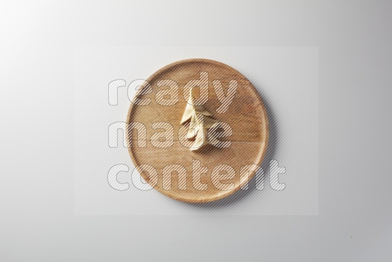 Three Sambosas on a wooden round plate on a white background