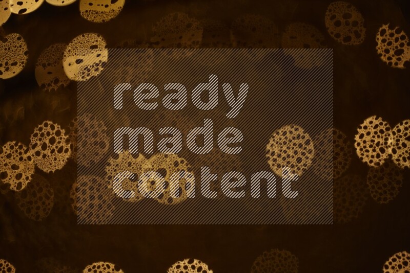 Bokeh light in yellow with water drops