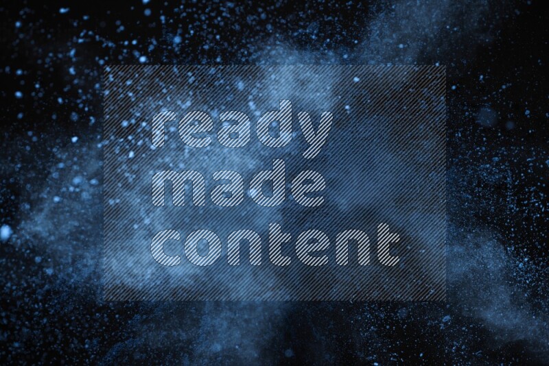Blue powder explosion on black background