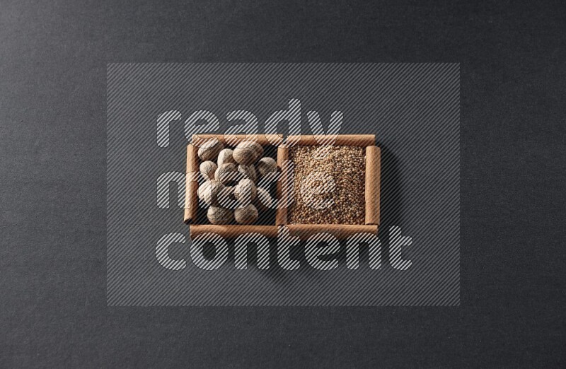 2 squares of cinnamon sticks full of mustard seeds and nutmeg on black flooring