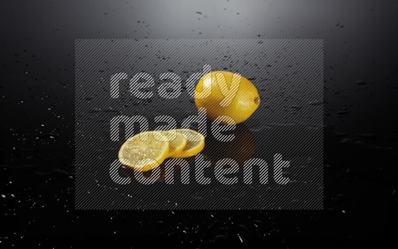 Lemon slices with water drops, and droplets on black background