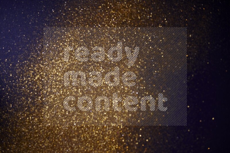 Gold glitter powder isolated on black background