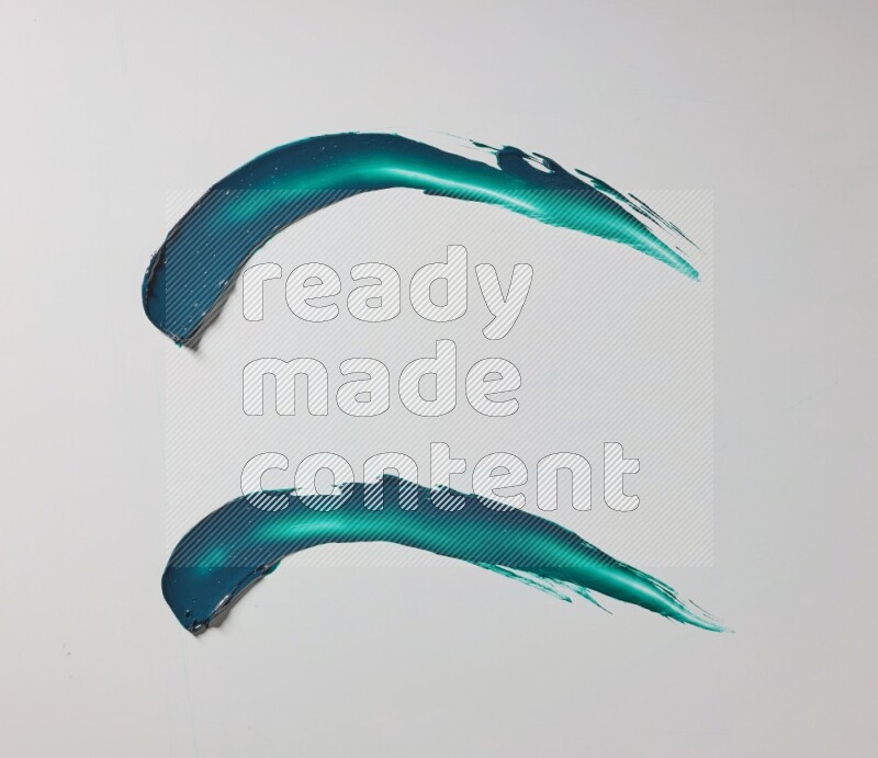 Turquoise curved painting knife strokes on white background