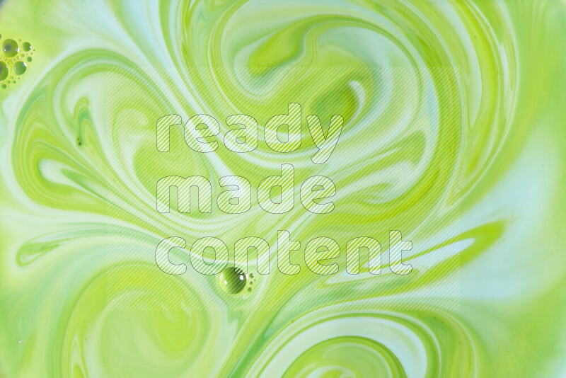 A close-up of abstract swirling patterns in green gradients