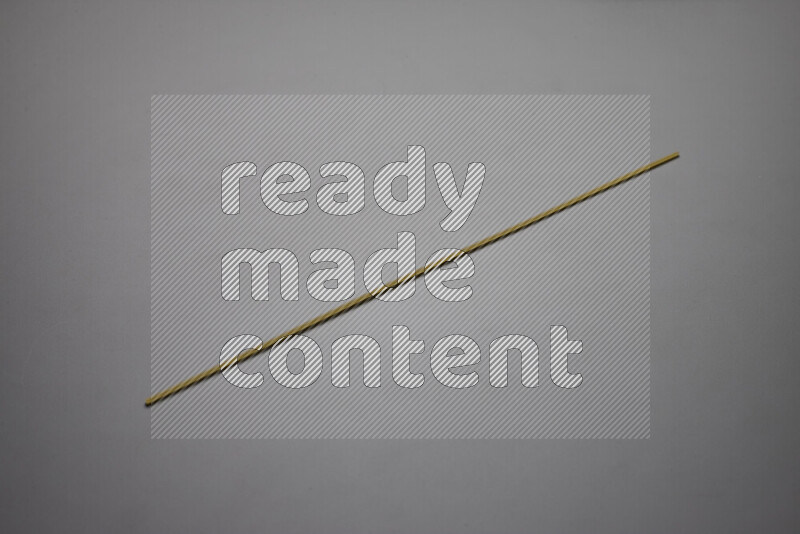 Spaghetti pasta on grey background