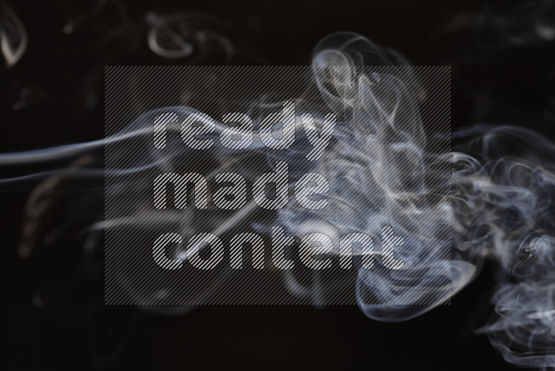 Motion of wavy smoke isolated on dark background
