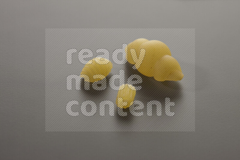 Different pasta types on grey background
