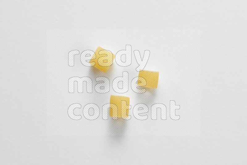 Big rings pasta on white background