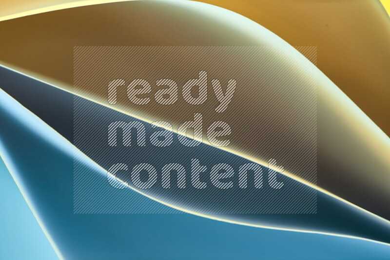 هذه الصورة تعرض تكوين فن الورق التجريدي مع منحنيات ورقية بتدرجات اللون الأزرق والأصفر المكونه بواسطة الضوء الملون