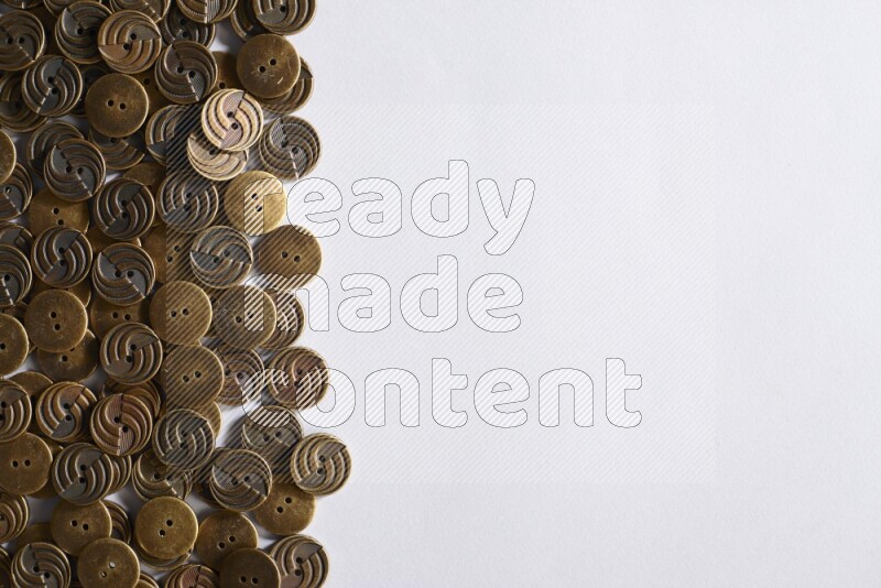 Metal buttons placed on grey background