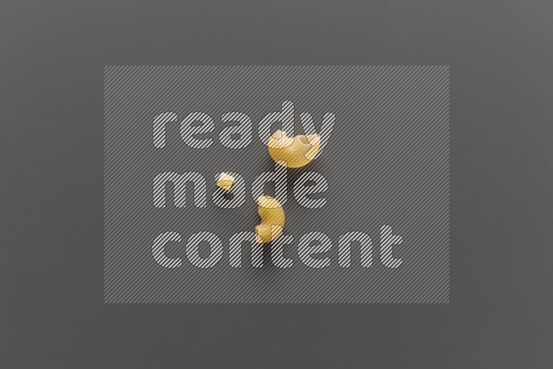 Different pasta types on grey background