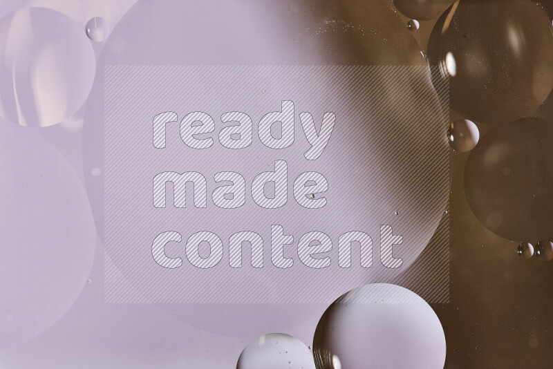 Close-ups of abstract oil bubbles on water surface in shades of white and brown