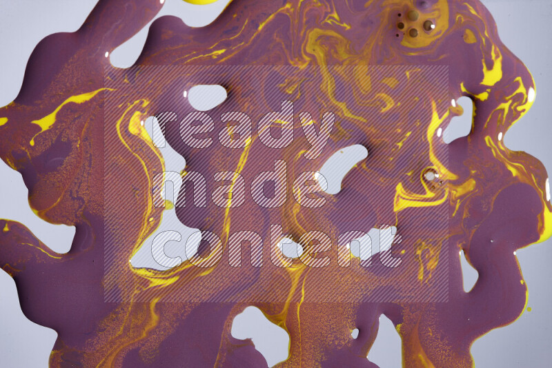 Abstract colorful background with mixed of purple and yellow paint colors