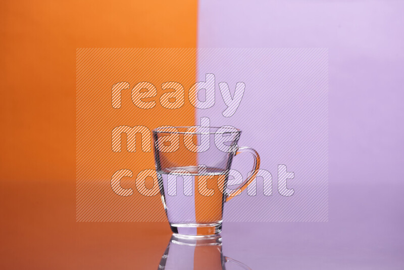 The image features a clear glassware filled with water, set against orange and light purple background