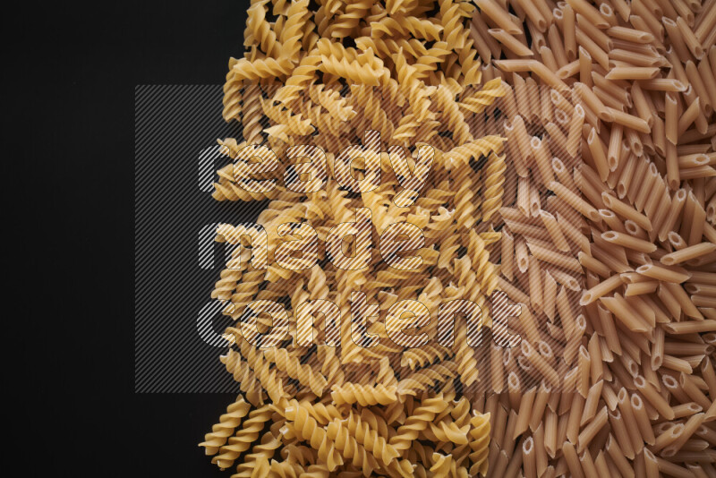 Different pasta types on black background