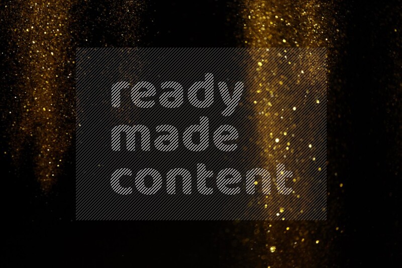 Gold glitter powder isolated on black background