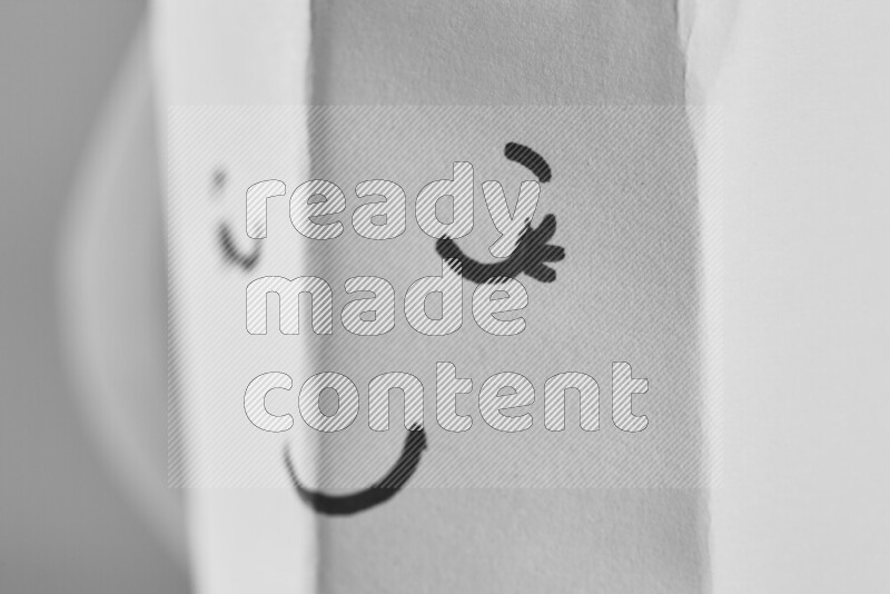 Origami cup on grey background