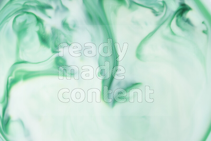 A close-up of abstract swirling patterns in green gradients