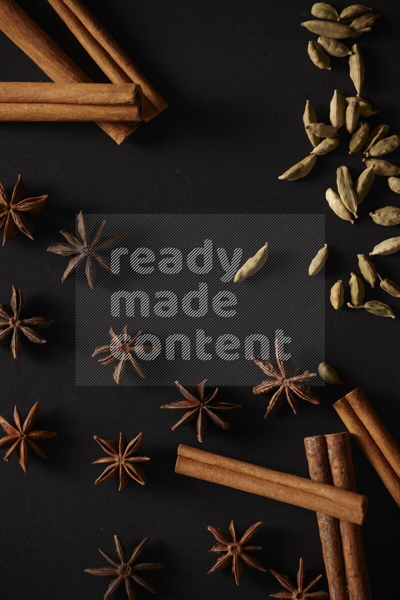 Cinnamon Sticks, Cardamom and star anise on a black background