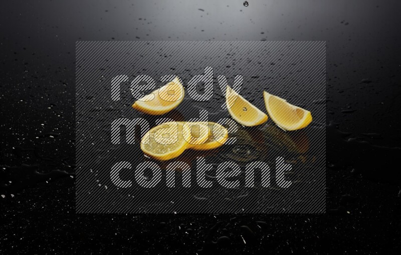 Lemon slices with water drops, and droplets on black background