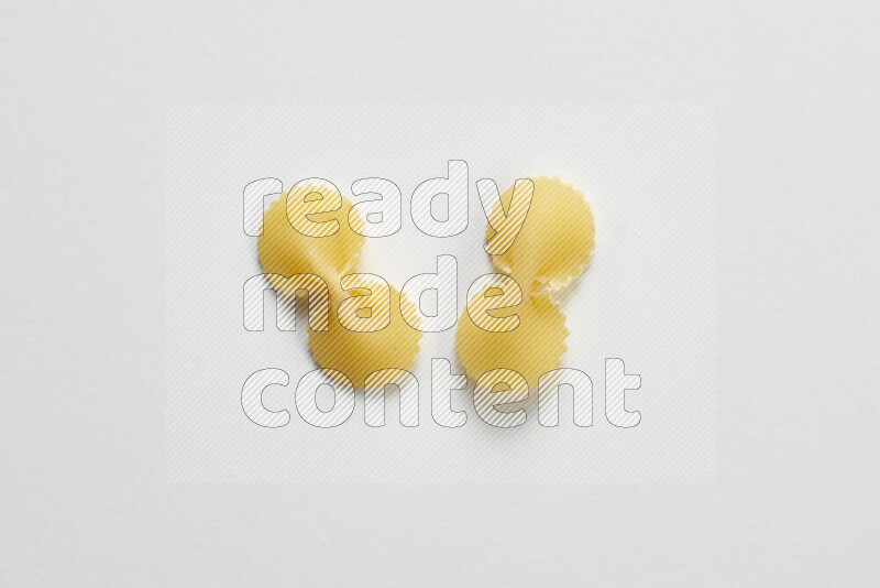 Fiocchi pasta on white background