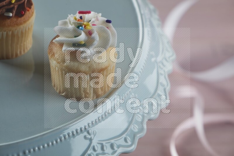 Vanilla mini cupcake topped with cream
