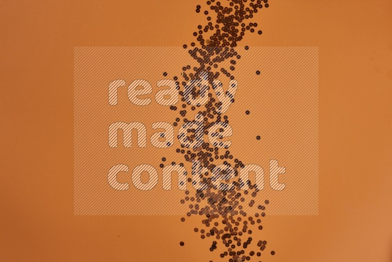 مجموعة من أدوات الخياطة والتفصيل برتقالية اللون على خلفية برتقالية