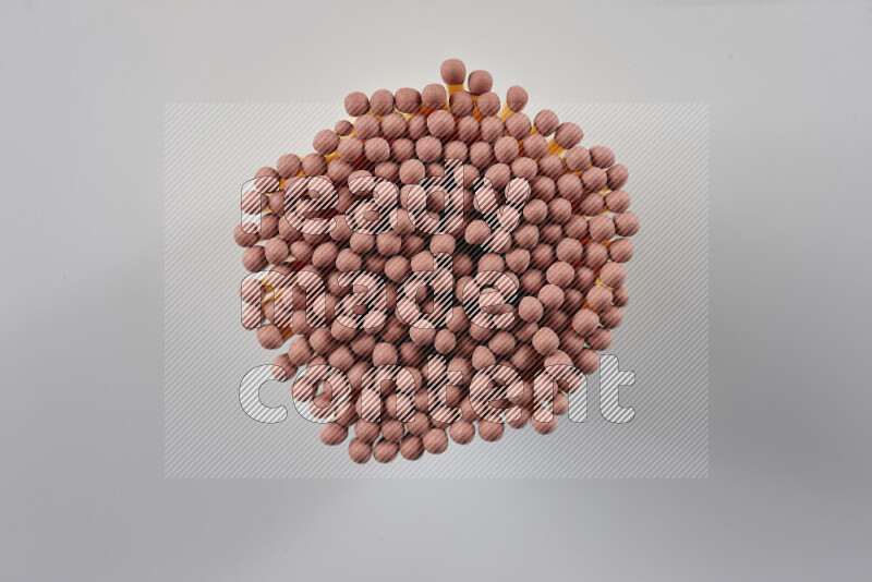 A close-up of a bundle of matches on grey background