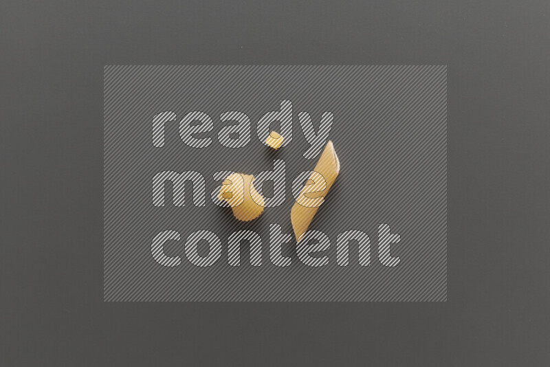 Different pasta types on grey background
