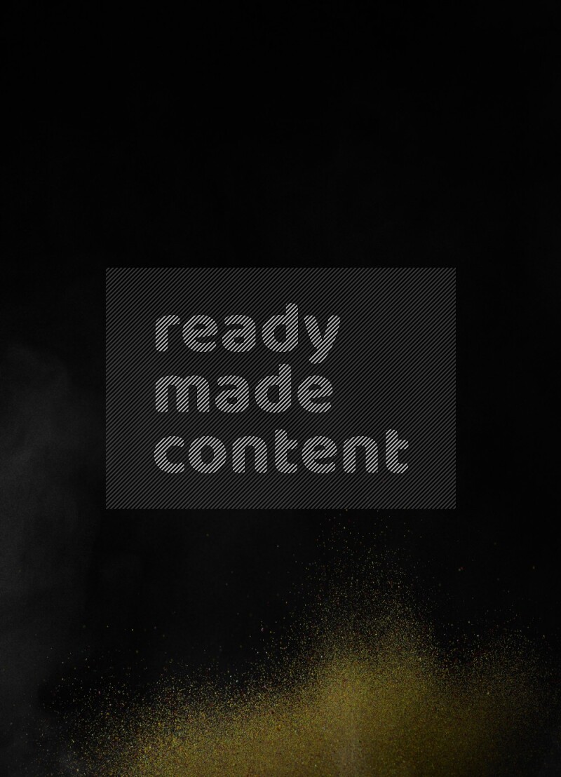 A side view of brown powder explosion on black background