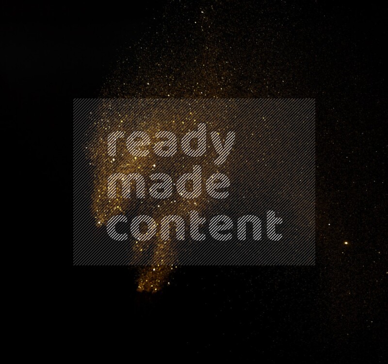 Gold glitter powder isolated on black background