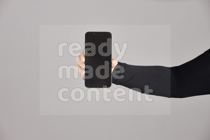 Woman hands holding different mobile phones in different positions
