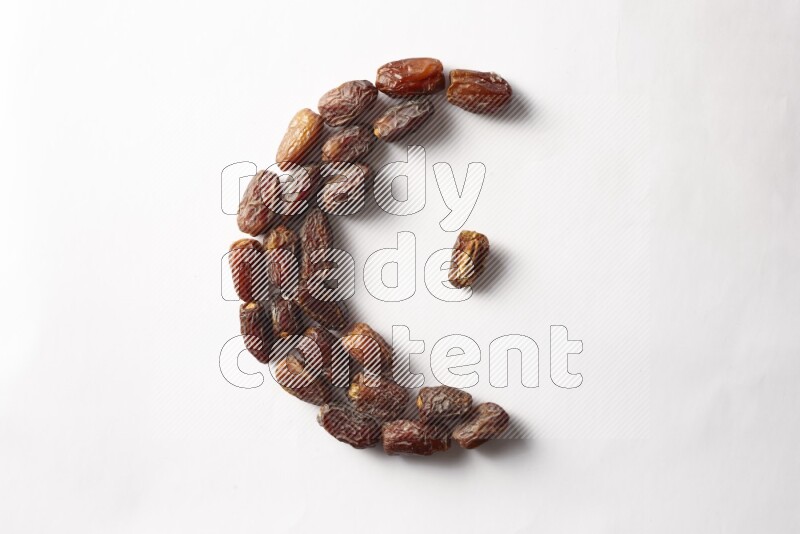 Dates in a crescent shape on white background
