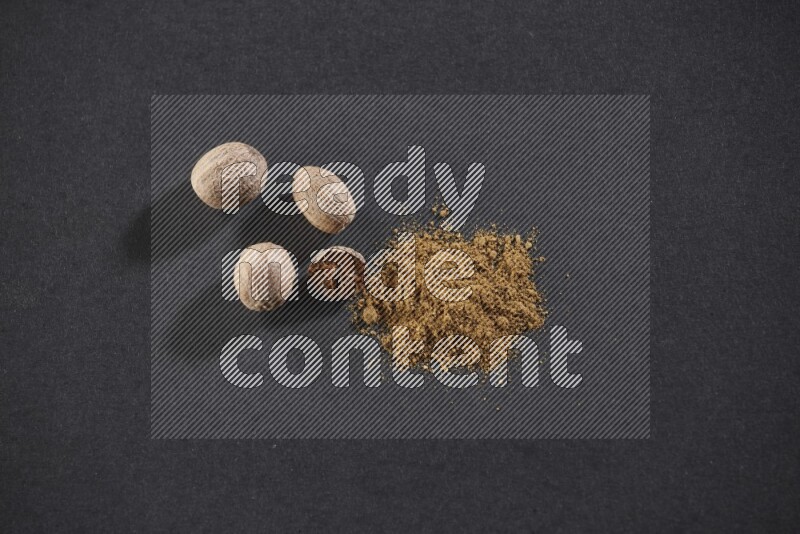 Nutmeg seeds with nutmeg powder beside it on a black flooring in different angles