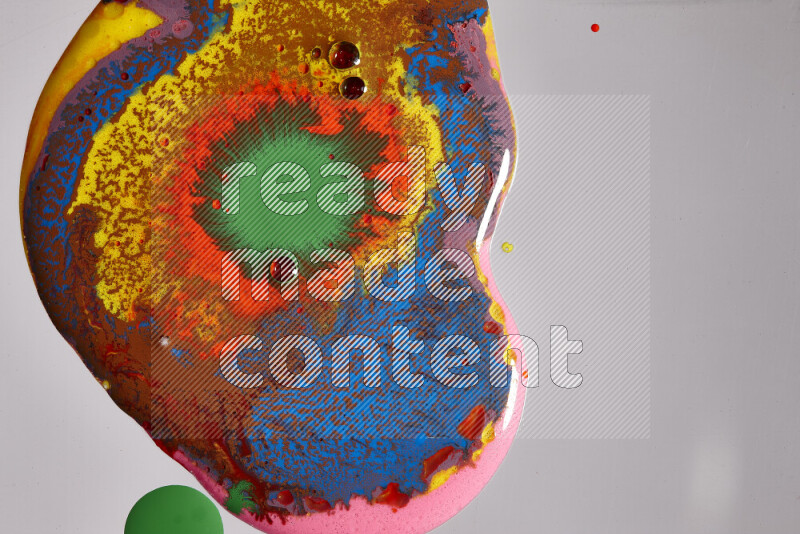 Close-ups of assorted colors blending on a grey background