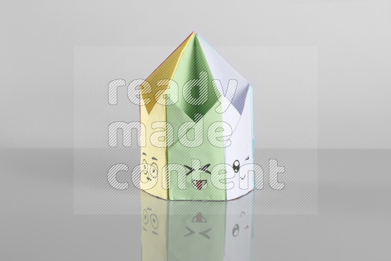 Origami pen holder on grey background