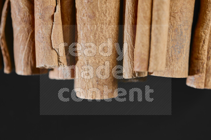 Cinnamon sticks on black background