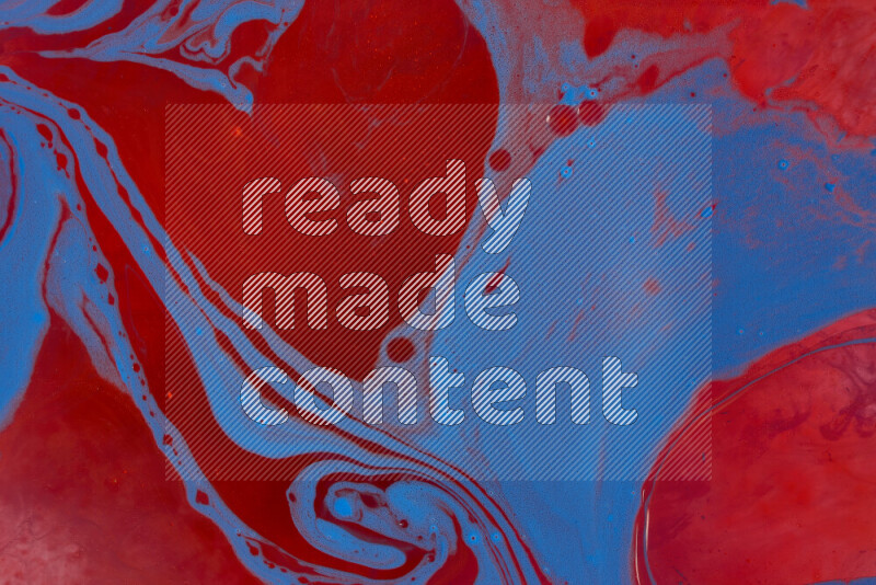 The image depicts a marbling effect with swirling patterns of red and blue