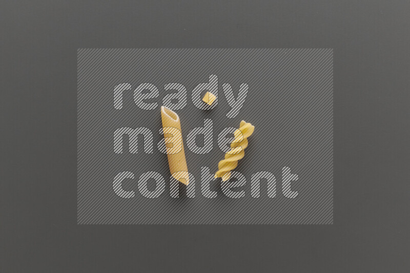 Different pasta types on grey background