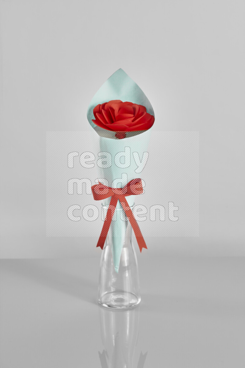 Origami flower bouquet on grey background